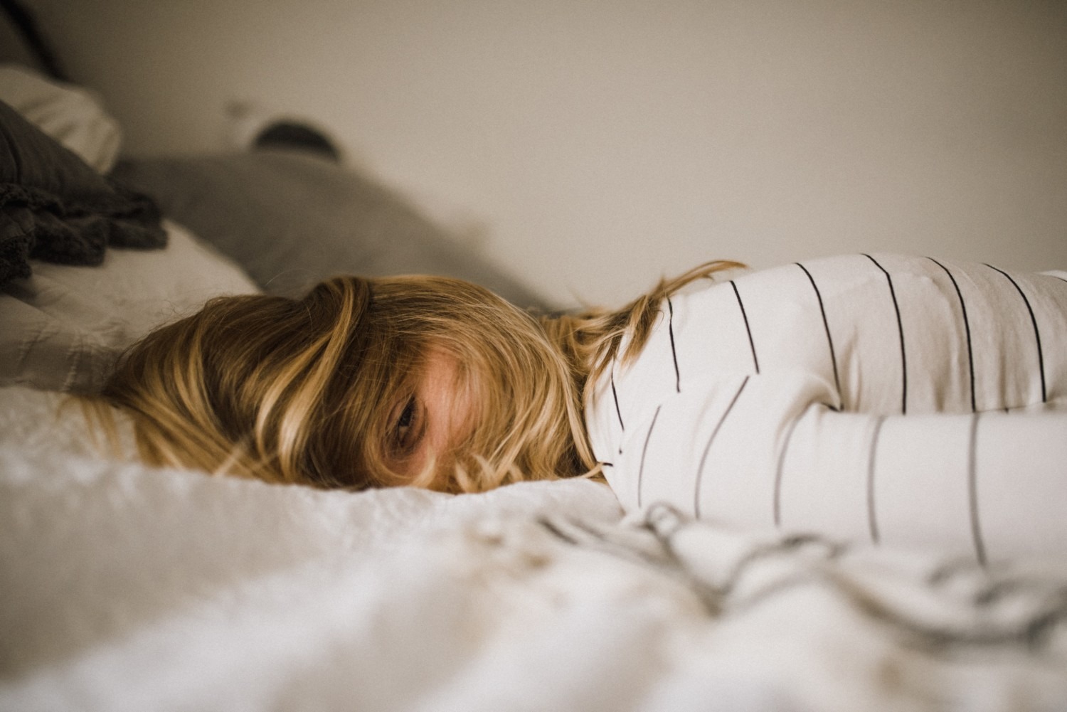 Woman laying on a bed