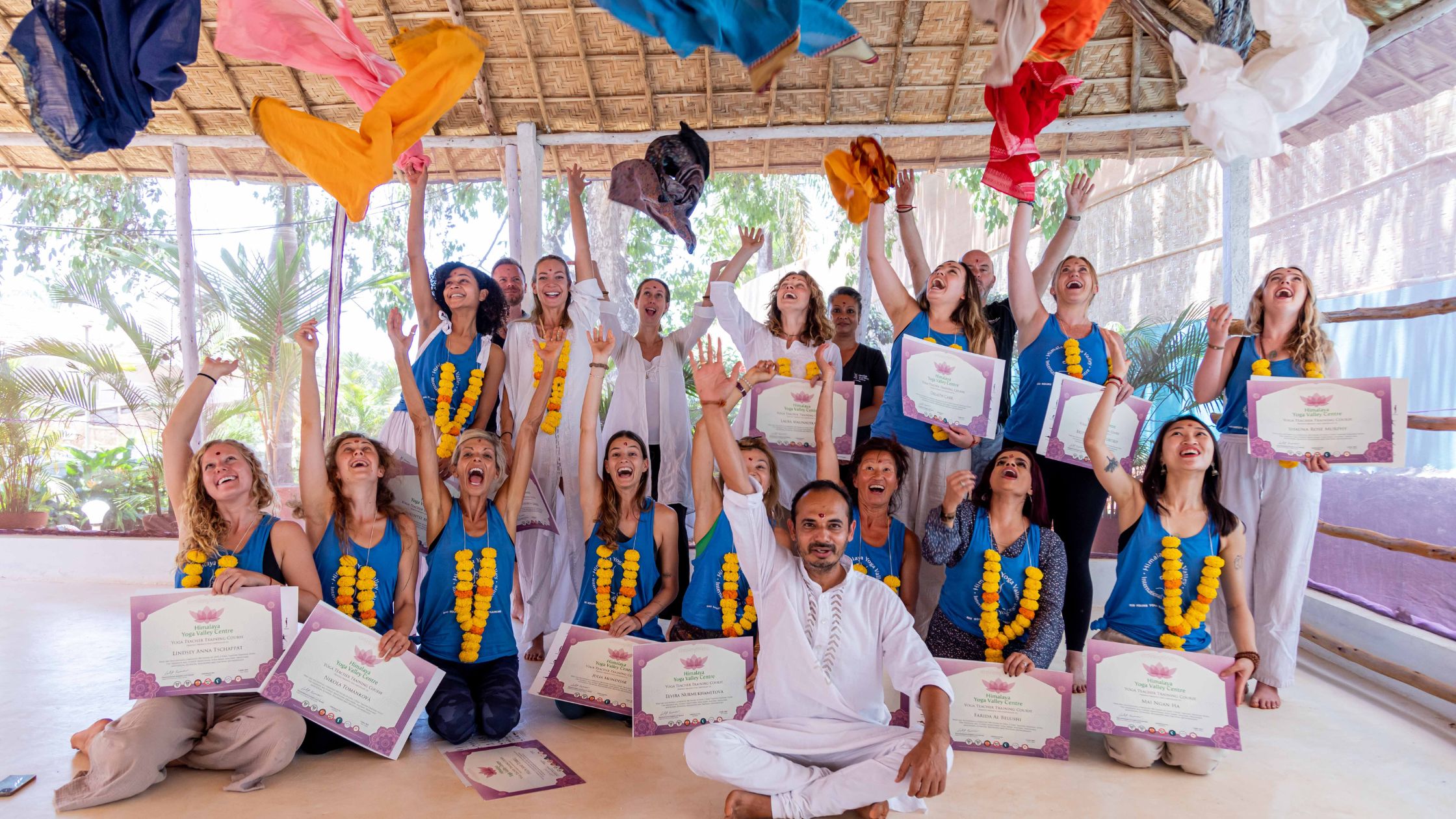 Happy 300HR yoga teacher training graduates celebrating after certification in Goa