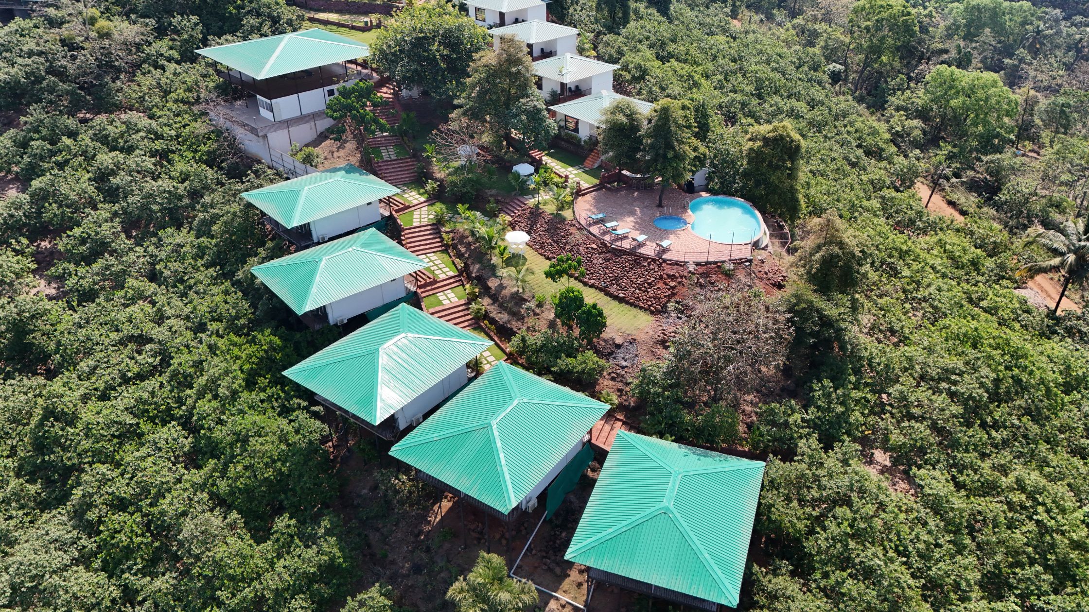 Yoga retreat space in Goa surrounded by palm trees and peaceful scenery