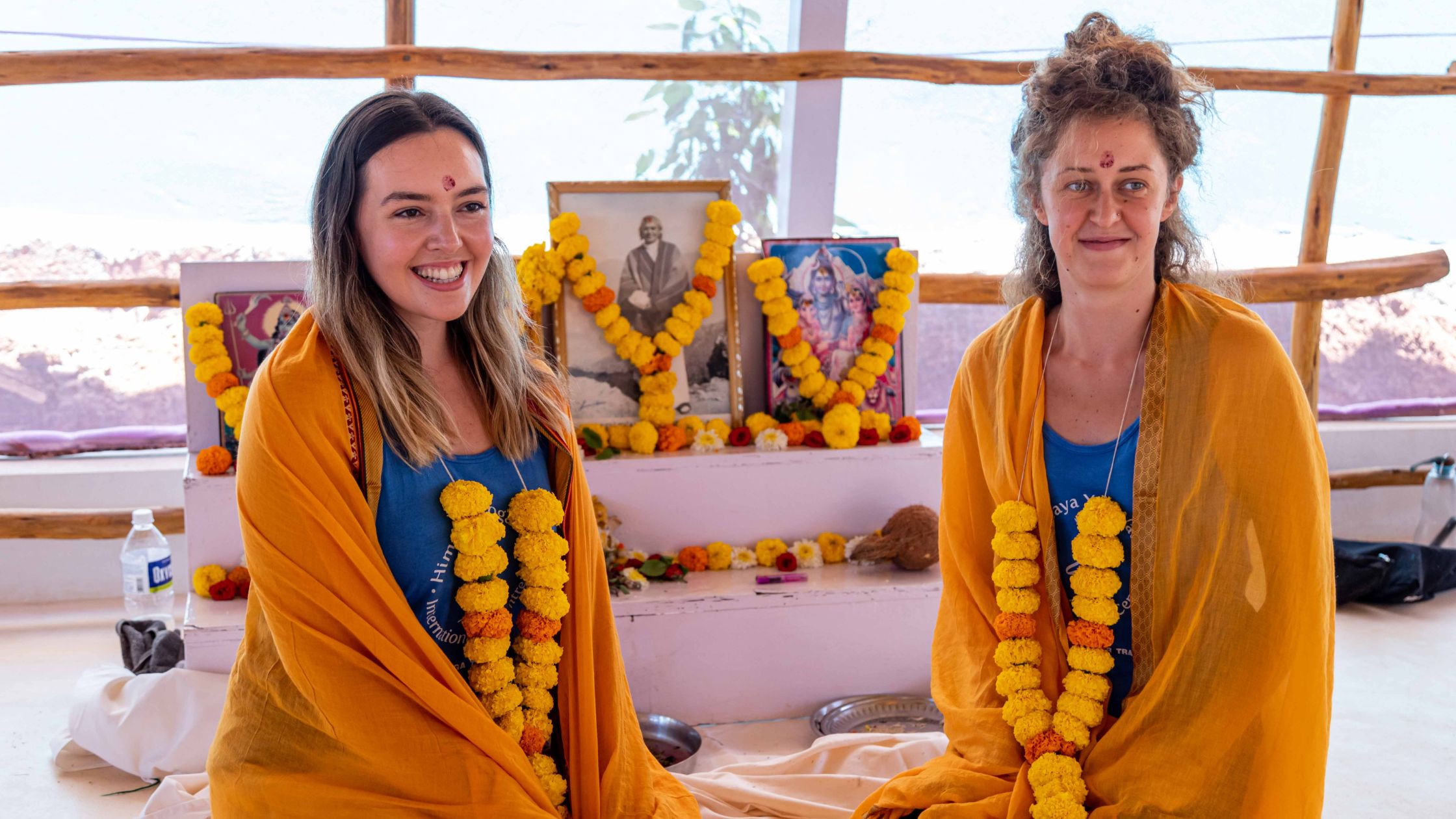 Group of trainees celebrating completion of their 300‑hour yoga teacher training on a beach in Goa