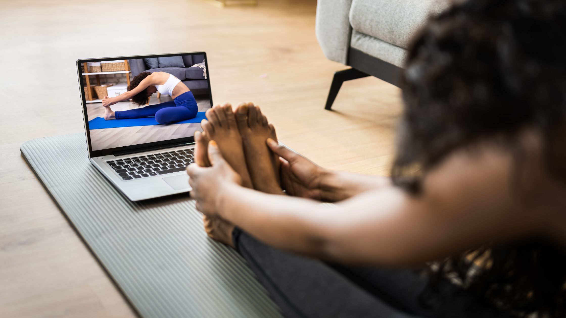 Yoga trainee practising sequences and verbal cues in a home yoga space applying yoga teaching tips